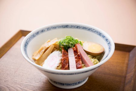 Japanese ramen noodles served in white bowl