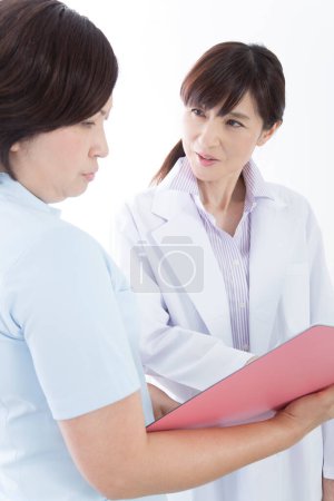 Photo for Studio portrait of Japanese medical doctor and nurse - Royalty Free Image