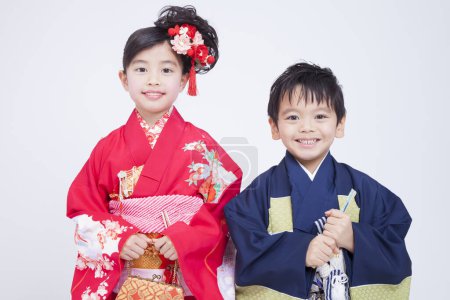 Photo for Portrait of japanese boy and girl isolated on white background - Royalty Free Image