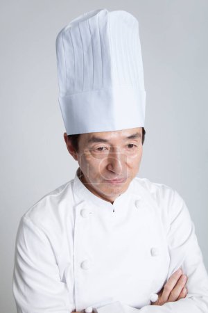 Foto de Asiático chef retrato en cocina - Imagen libre de derechos