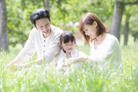 Photo for Asian family playing in the park - Royalty Free Image