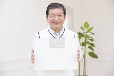 Photo for Asian senior man holding blank sign - Royalty Free Image