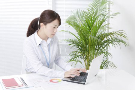 Photo for Woman working with laptop - Royalty Free Image