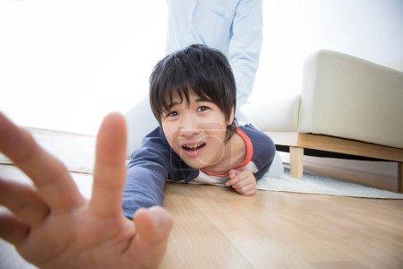 asian father punishing son. Home abuse concept