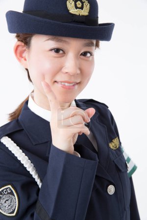 Photo for Studio portrait of Japanese female police officer - Royalty Free Image