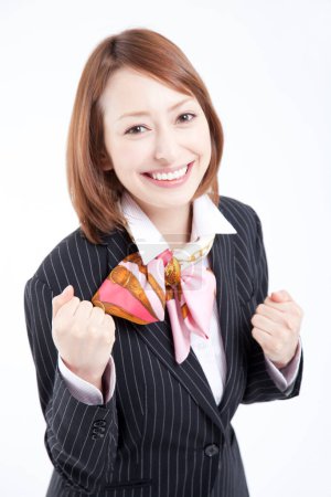 Téléchargez les photos : Femme d'affaires avec les poings vers le haut sur fond blanc - en image libre de droit