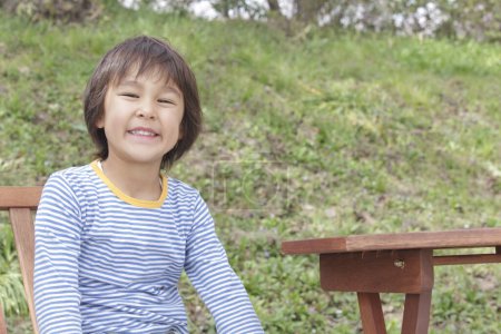Photo for Portrait of asian boy in park - Royalty Free Image