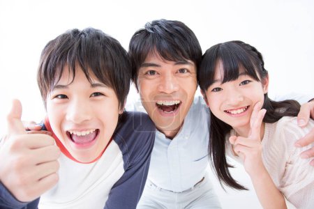 Photo for Studio portrait of smiling Japanese family - Royalty Free Image