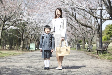 Photo for Asian mother and son posing in the park - Royalty Free Image