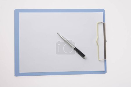 Photo for Blank paper with pen on white background - Royalty Free Image