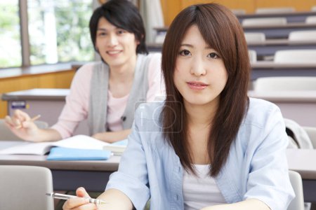 Photo for Portrait of asian students studying in auditorium - Royalty Free Image