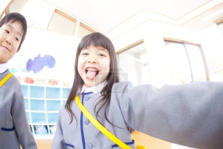 Photo for Adorable little girl wearing uniform in elementary school - Royalty Free Image