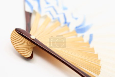 Photo for Close up view of Japanese folding fan isolated on white background - Royalty Free Image