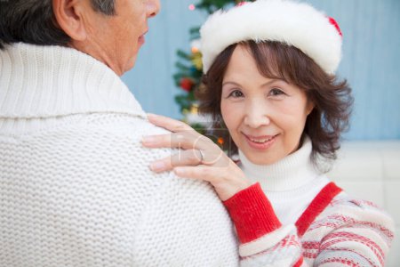 Photo for Asian senior  couple dancing on  Christmas at home - Royalty Free Image
