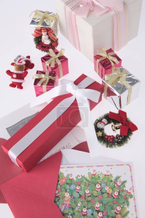Foto de Gift boxes with Christmas decorations on white background - Imagen libre de derechos