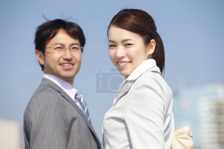 Photo for Asian business people smiling outdoors - Royalty Free Image