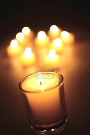 Photo for Many burning candles on black background - Royalty Free Image