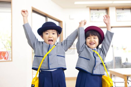 Photo for Two cheerful Japanese children in elementary school - Royalty Free Image