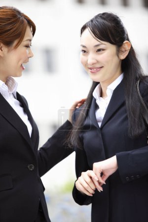 Photo for Two women  standing next to each other outdoors - Royalty Free Image