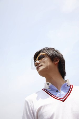 Photo for Close up portrait of handsome Japanese man with sunglasses - Royalty Free Image