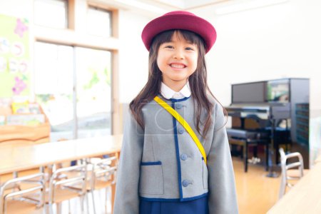 Photo for Adorable little girl wearing uniform in elementary school - Royalty Free Image