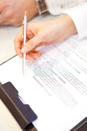 Photo for Close up of businessman 's hands signing document - Royalty Free Image