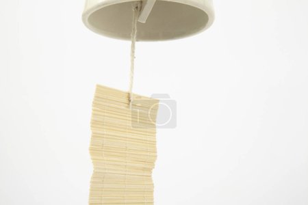 close up view of beautiful Japanese wind chime on white background