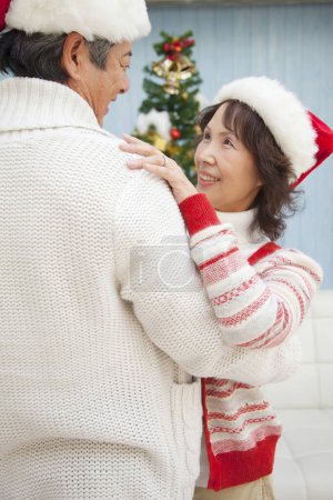 Photo for Asian senior woman dancing with man  Christmas at home - Royalty Free Image
