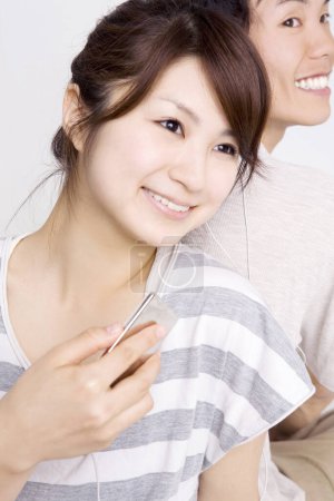 Photo for Portrait of happy Japanese young couple - Royalty Free Image