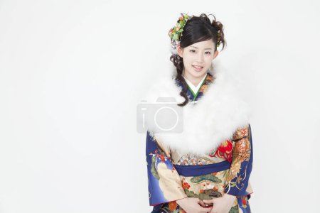 Photo for Beautiful Japanese young woman in traditional costume isolated on white - Royalty Free Image