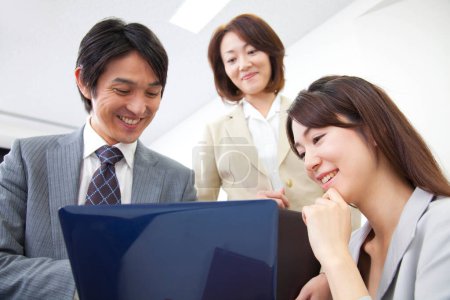 Photo for Portrait of successful japanese business team at office - Royalty Free Image