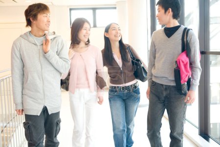 Photo for Cheerful Japanese students in university corridor - Royalty Free Image