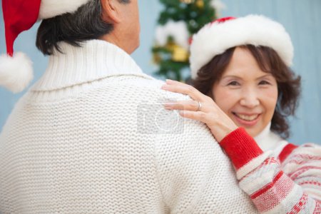 Photo for Asian senior man and woman  dancing on  Christmas at home - Royalty Free Image