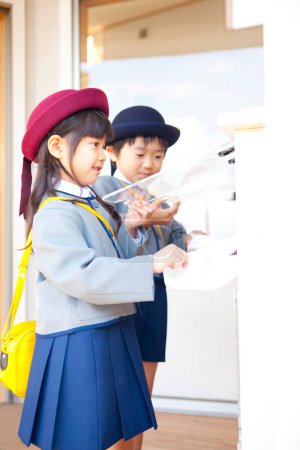Photo for Two cute Japanese children in elementary school - Royalty Free Image