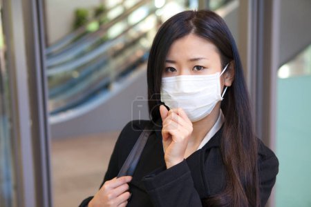 Photo for Asian business  woman wearing a face mask - Royalty Free Image