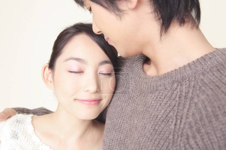Closeup portrait of Japanese loving couple in winter sweaters