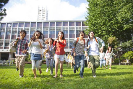 Photo for Asian happy college students groupmates posing near university - Royalty Free Image