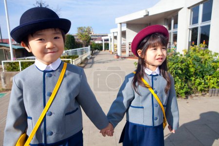 Photo for Two cheerful Japanese children in elementary school - Royalty Free Image