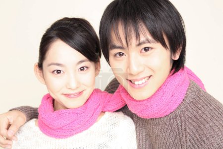 Closeup portrait of Japanese loving couple in winter sweaters