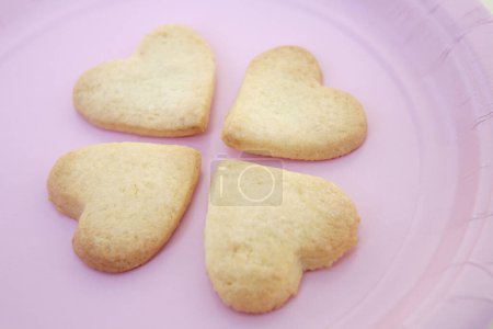 Photo for Freshly baked delicious heart shaped cookies. Valentines day concept - Royalty Free Image