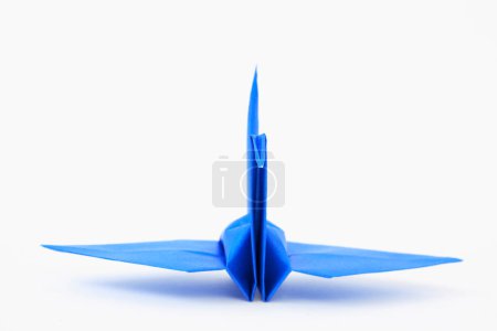 Photo for Blue paper origami crane on white background - Royalty Free Image