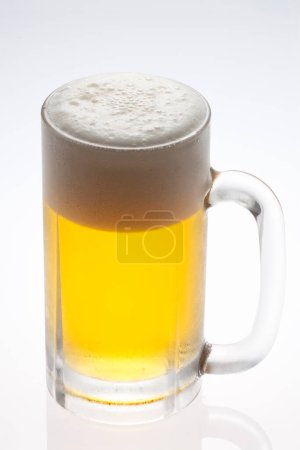 Photo for Glass of beer with foam on top - Royalty Free Image