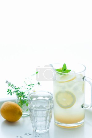 Photo for Refreshing lemonade in glass on table - Royalty Free Image