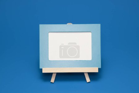 Photo for Blank canvas frame with copy space. Easel - Royalty Free Image