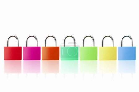 Photo for Close up view of colorful padlocks on white table background - Royalty Free Image
