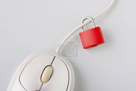 Photo for Computer mouse with small padlock on white background - Royalty Free Image