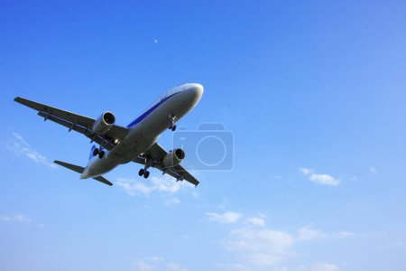 Photo for Modern plane flying in sky, daytime view - Royalty Free Image