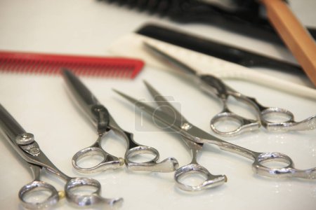 Photo for Close up view of scissors on table. hairdresser accessories - Royalty Free Image