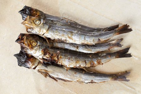 dried mackerels on kitchen table, close up view