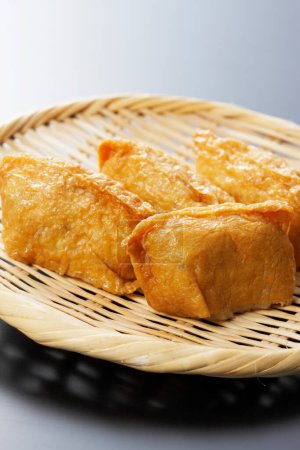 close up view of seasoned rice wrapped In fried tofu bags